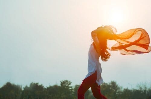 woman spreading hair at during sunset